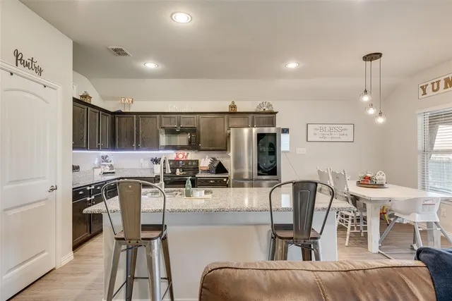 a view of a dining room with furniture and window