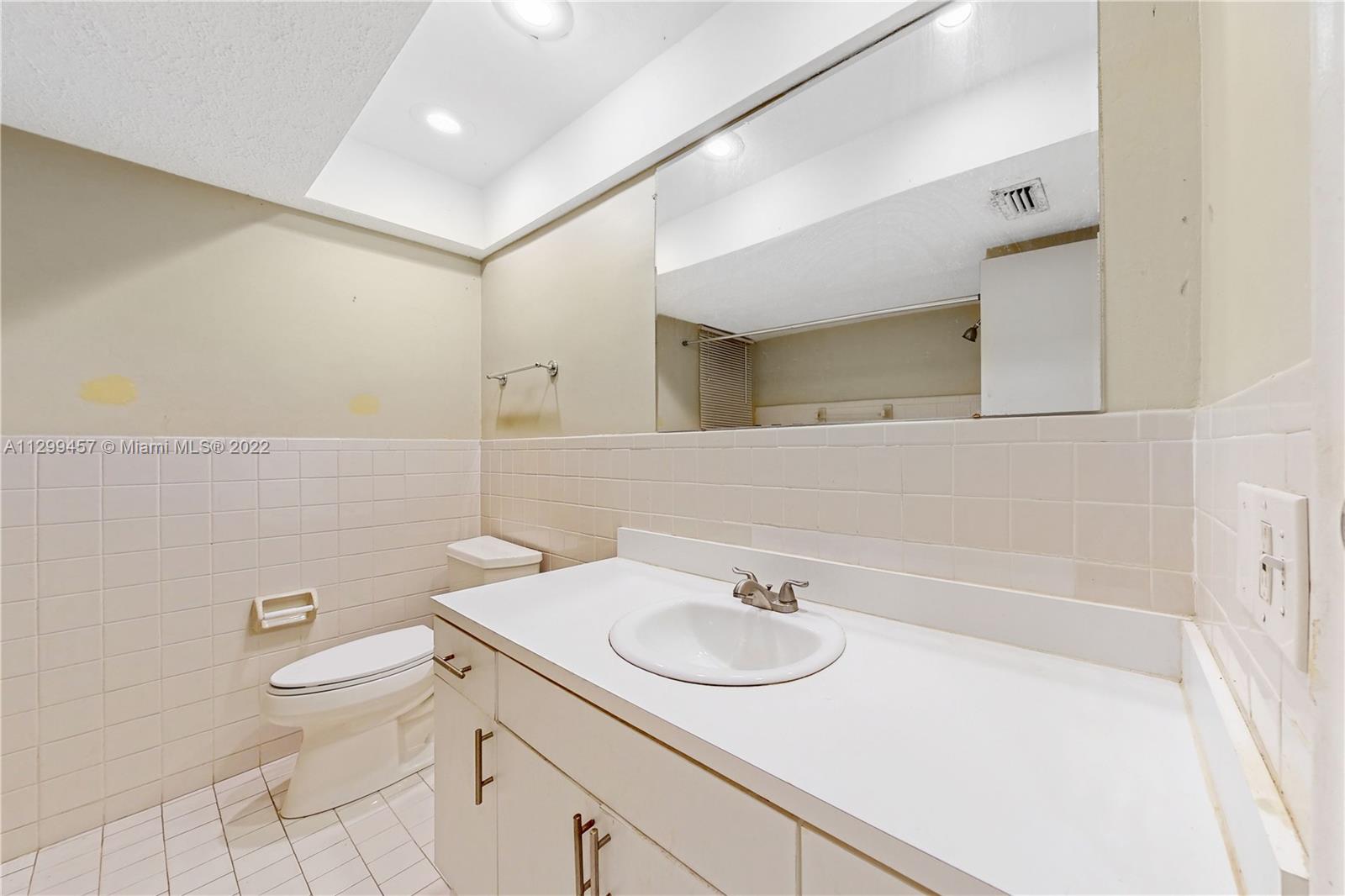 6745 Pansy Drive Miramar, FL 33023 - Photo 18 of 33 a bathroom with a sink and a toilet