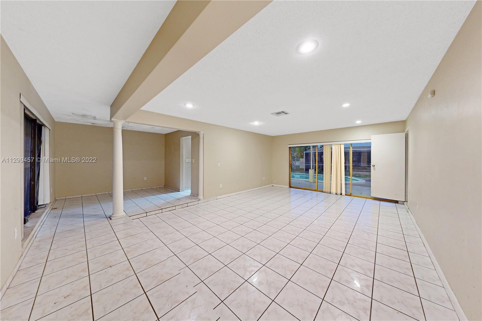 6745 Pansy Drive Miramar, FL 33023 - Photo 2 of 33 a view of an empty room with window and chandelier