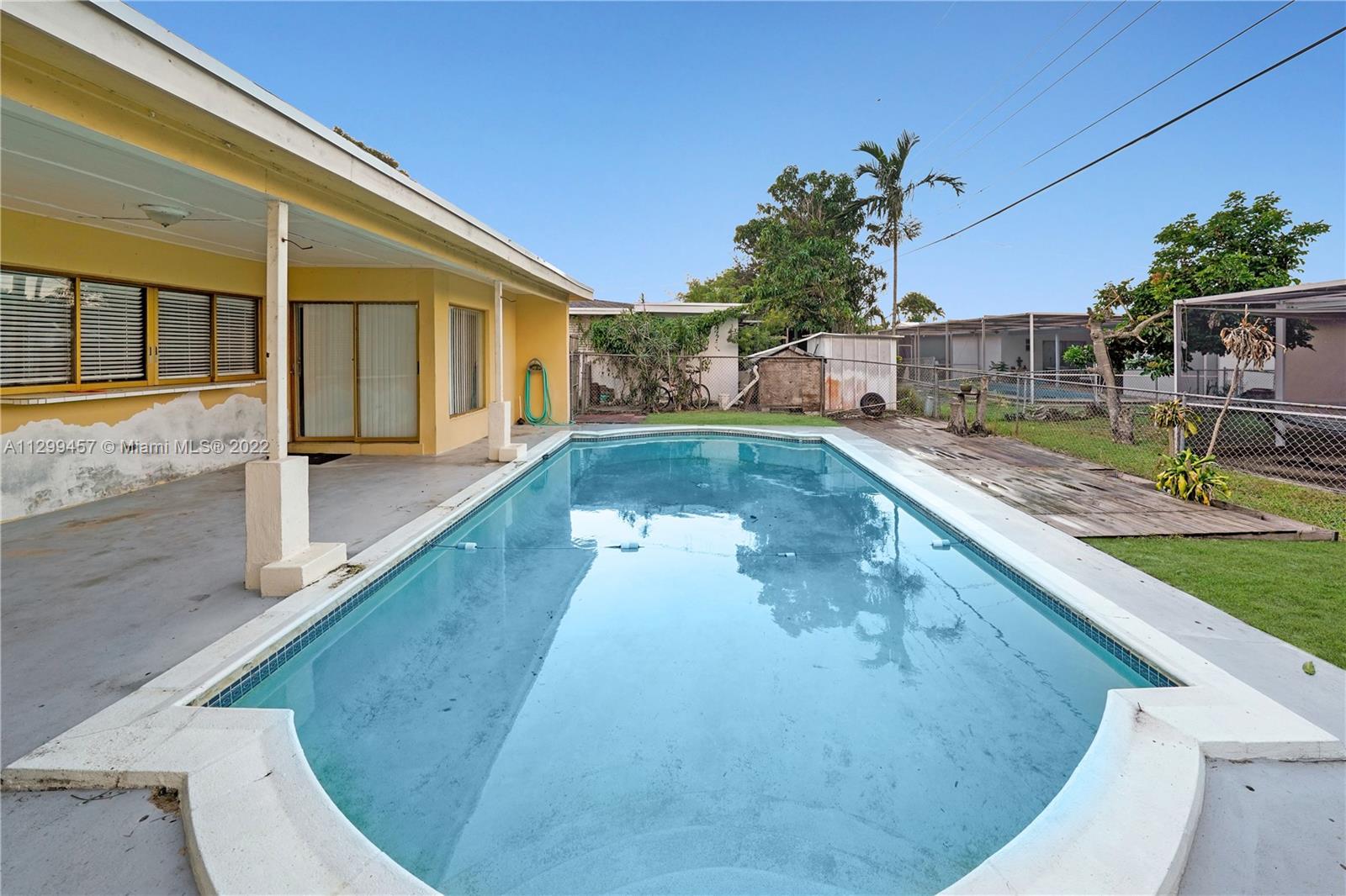6745 Pansy Drive Miramar, FL 33023 - Photo 28 of 33 a view of a house with a swimming pool
