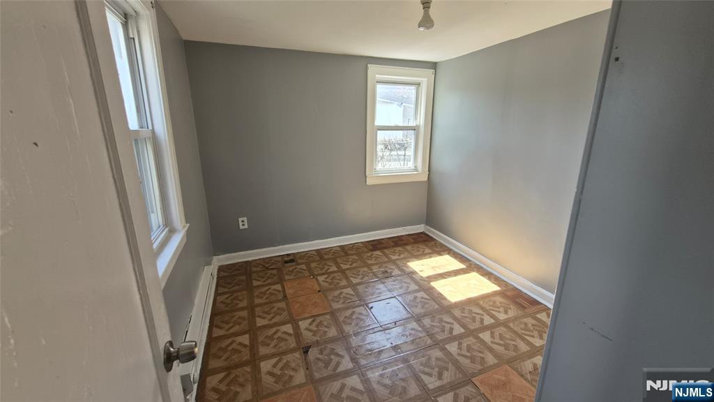 309 Hudson Street Hackensack, NJ 07601 - Photo 3 of 6 a view of an empty room and a window