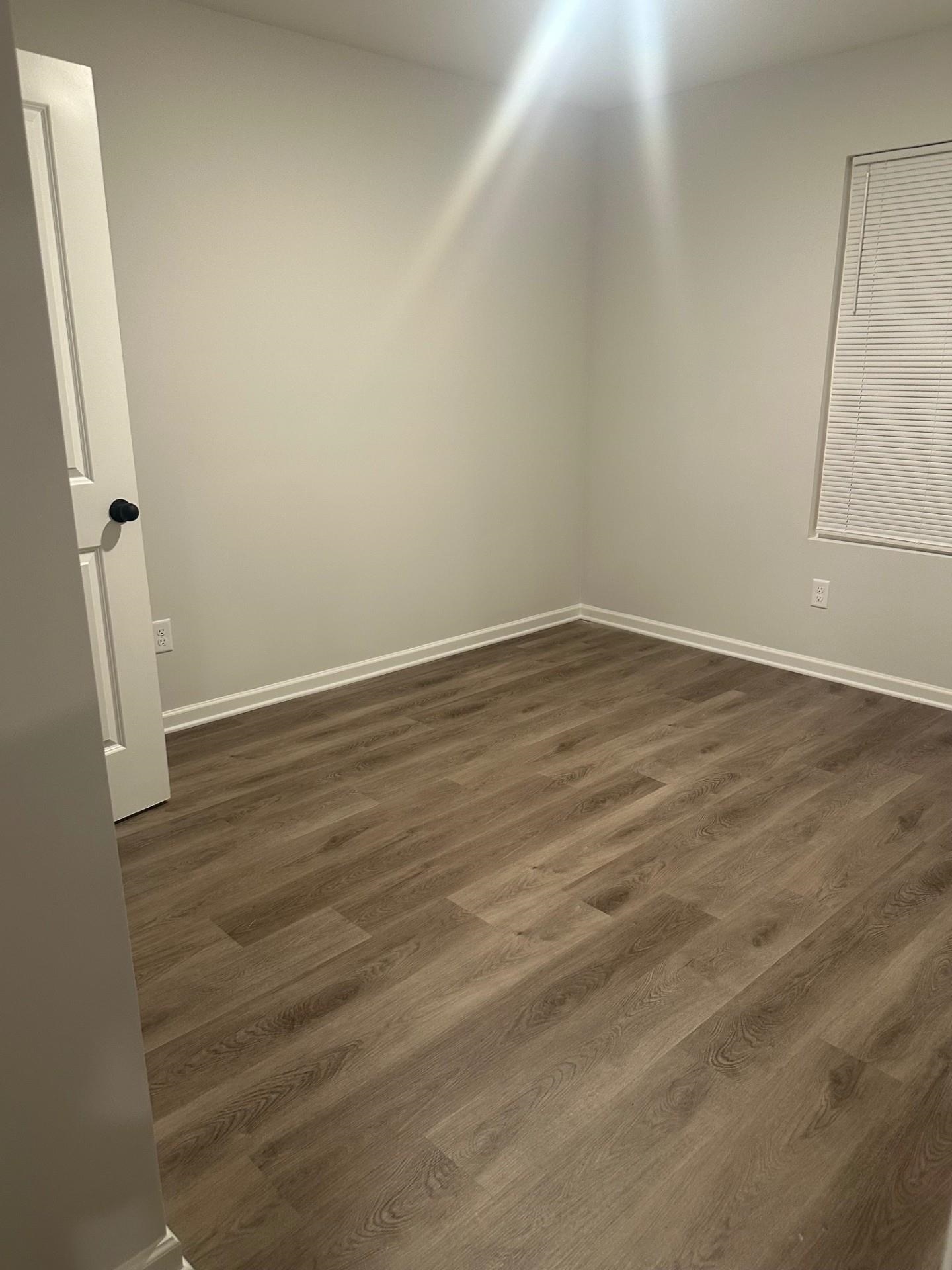 2585 Callie Road Memphis, TN 38127 - Photo 11 of 13 Unfurnished room featuring baseboards and dark wood-type flooring