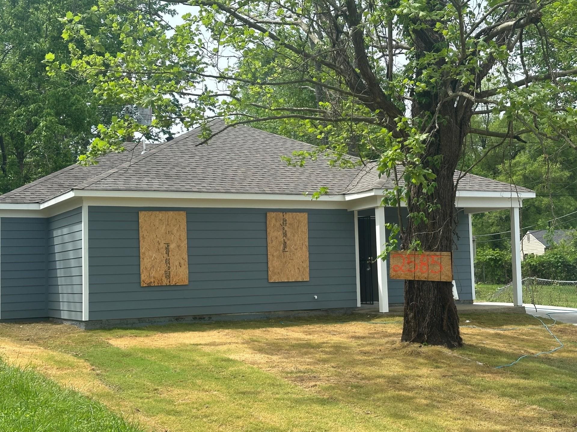 2585 Callie Road Memphis, TN 38127 - Photo 3 of 13 View of property exterior featuring a lawn and a shingled roof
