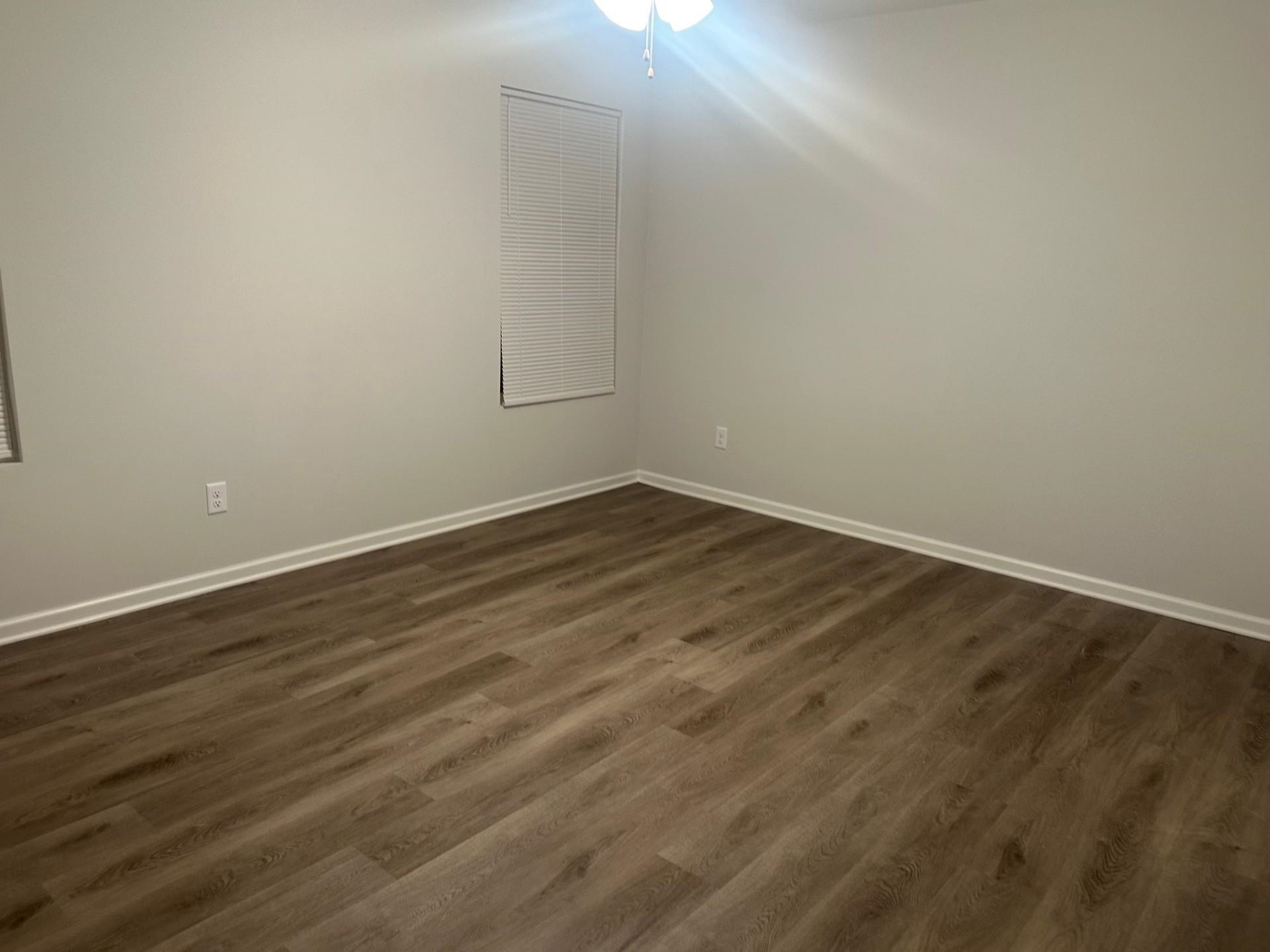 2585 Callie Road Memphis, TN 38127 - Photo 9 of 13 Spare room with dark wood finished floors and baseboards
