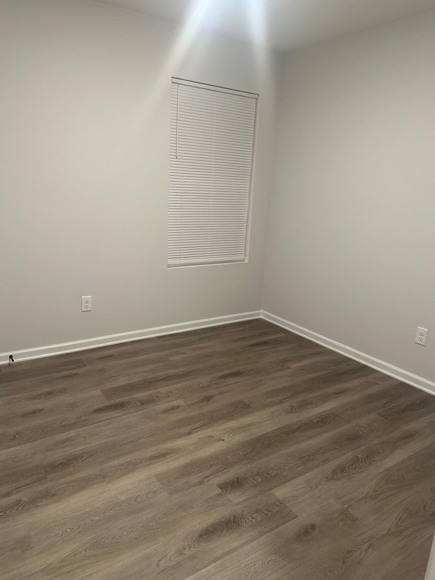 2585 Callie Road Memphis, TN 38127 - Photo 10 of 13 Unfurnished room featuring baseboards and dark wood-type flooring