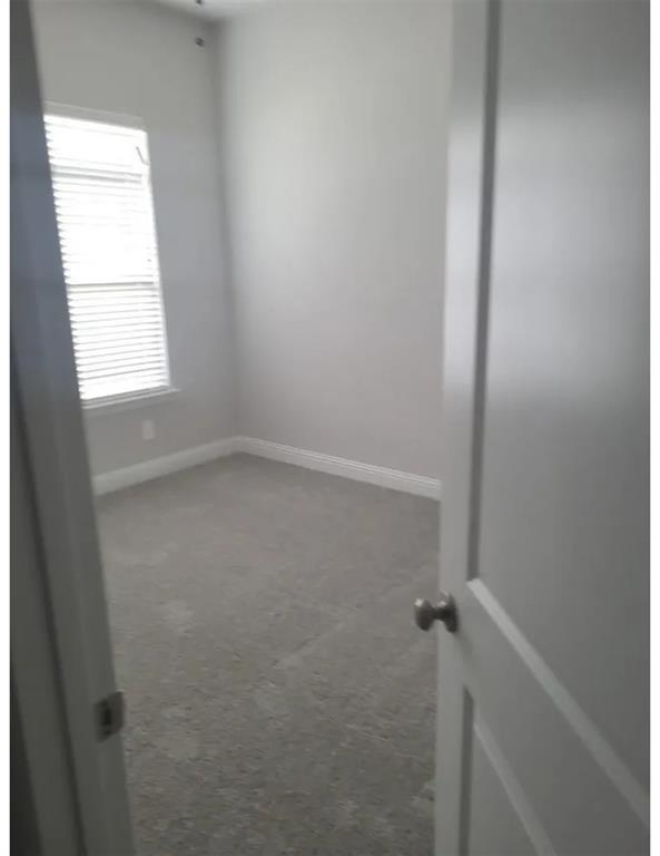 337 Eagle Ridge Road Forney, TX 75126 - Photo 10 of 16 an empty room with a window