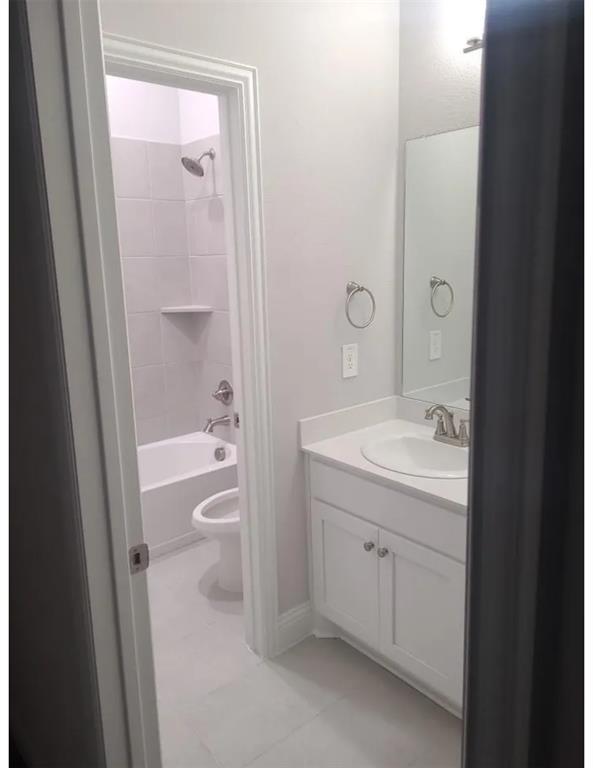 337 Eagle Ridge Road Forney, TX 75126 - Photo 11 of 16 a bathroom with a granite countertop sink a toilet and shower