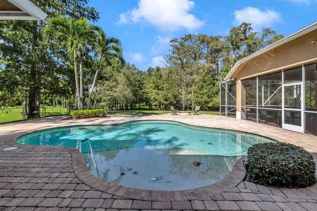 a view of a fountain in front of a house