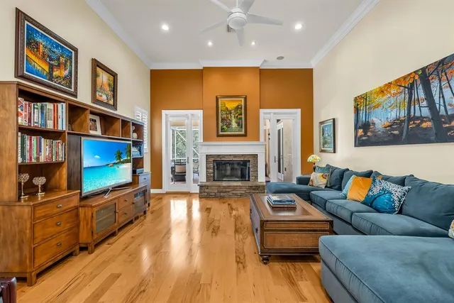 a living room with furniture fireplace and flat screen tv