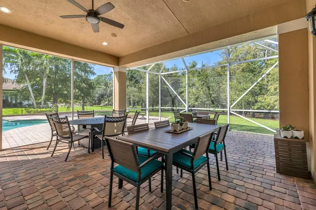 a view of a dining room with furniture window and outside view