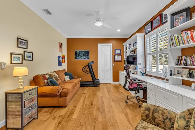 a bedroom with furniture and a book shelf