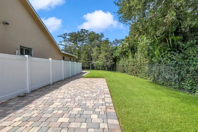 a view of a back yard of the house