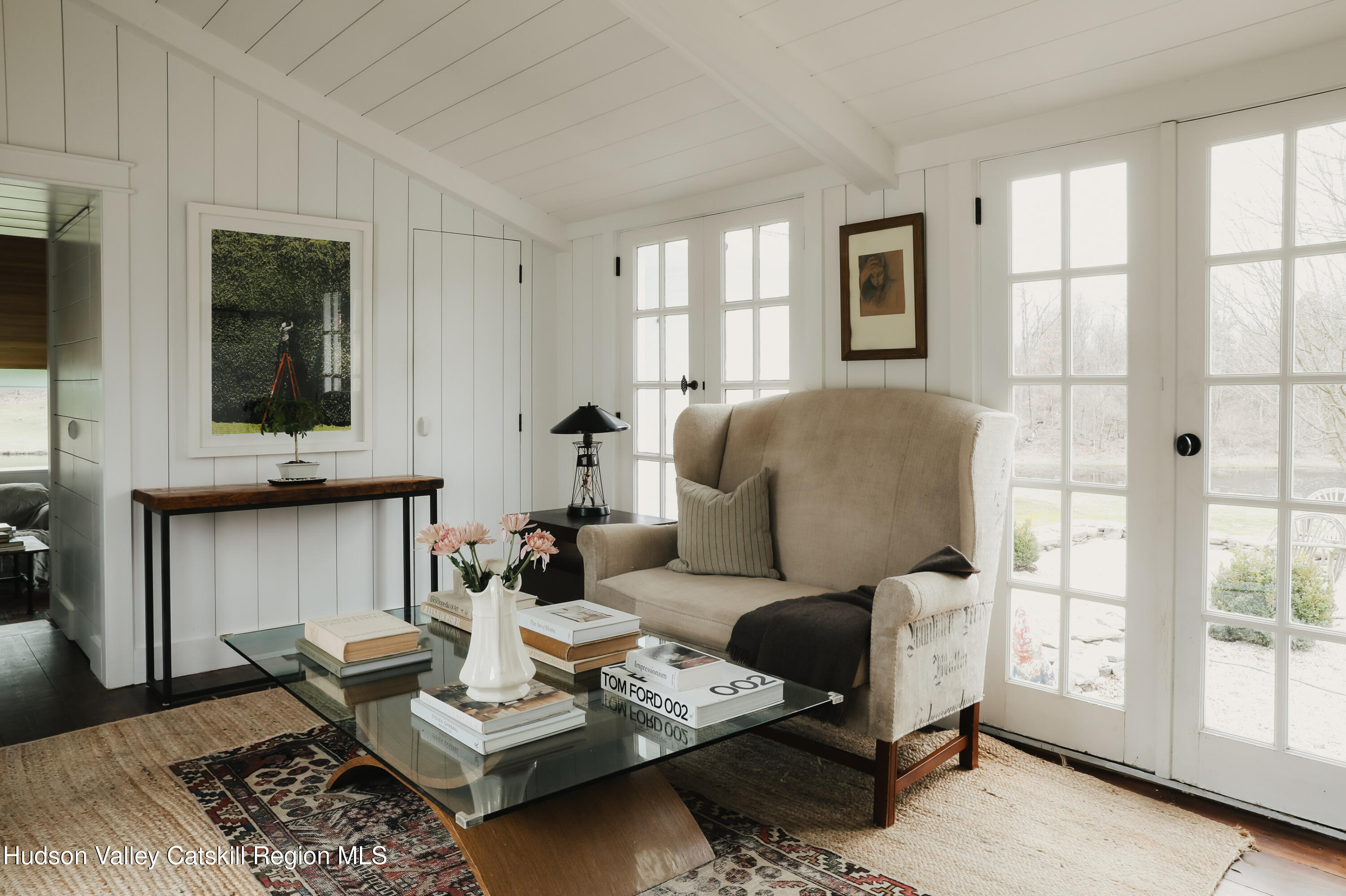433 Rapp Road Valatie, NY 12184 - Photo 25 of 61 a living room with furniture potted plant and a window