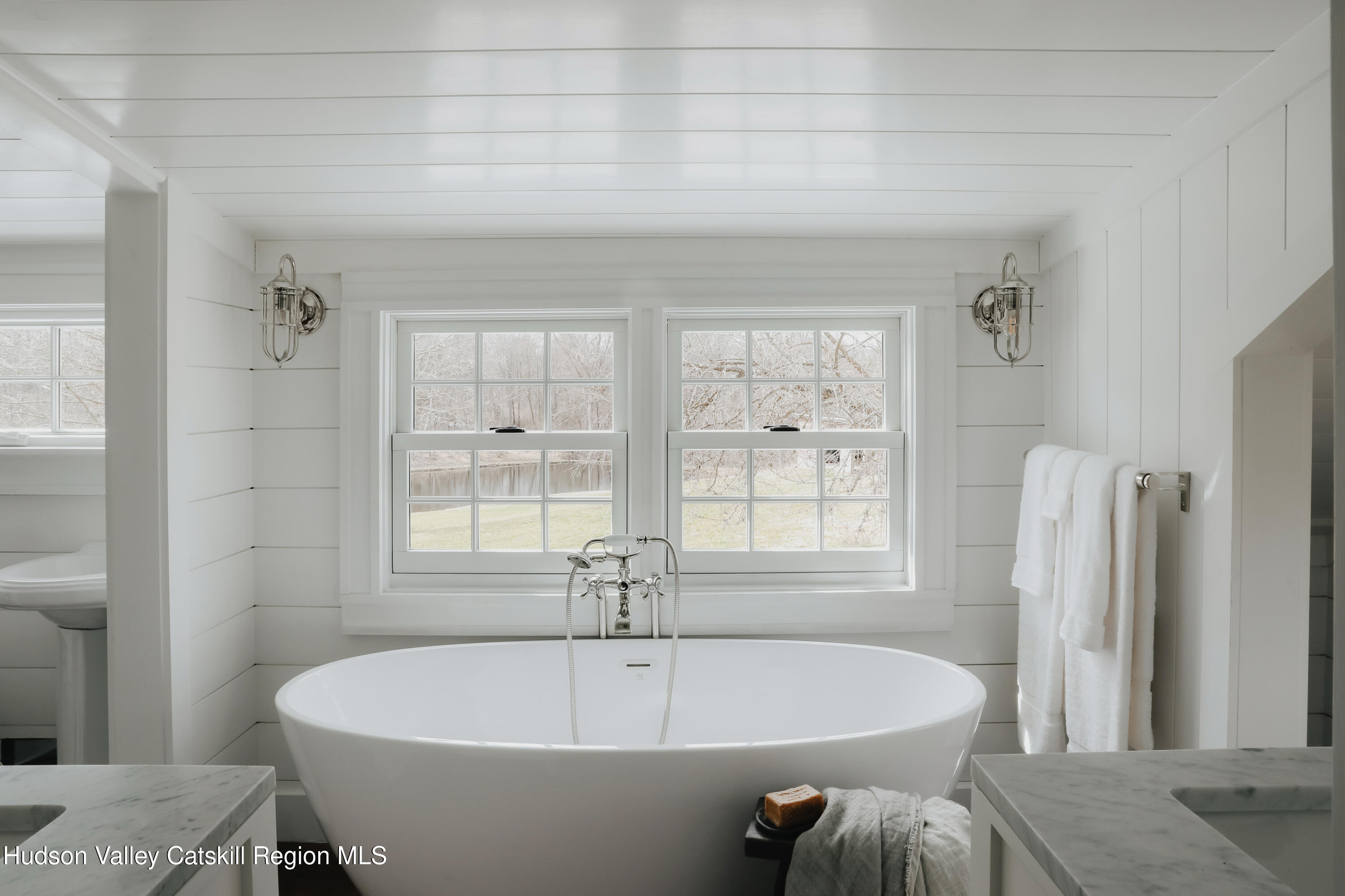 433 Rapp Road Valatie, NY 12184 - Photo 37 of 61 a white bath tub sitting in a bathroom next to a window