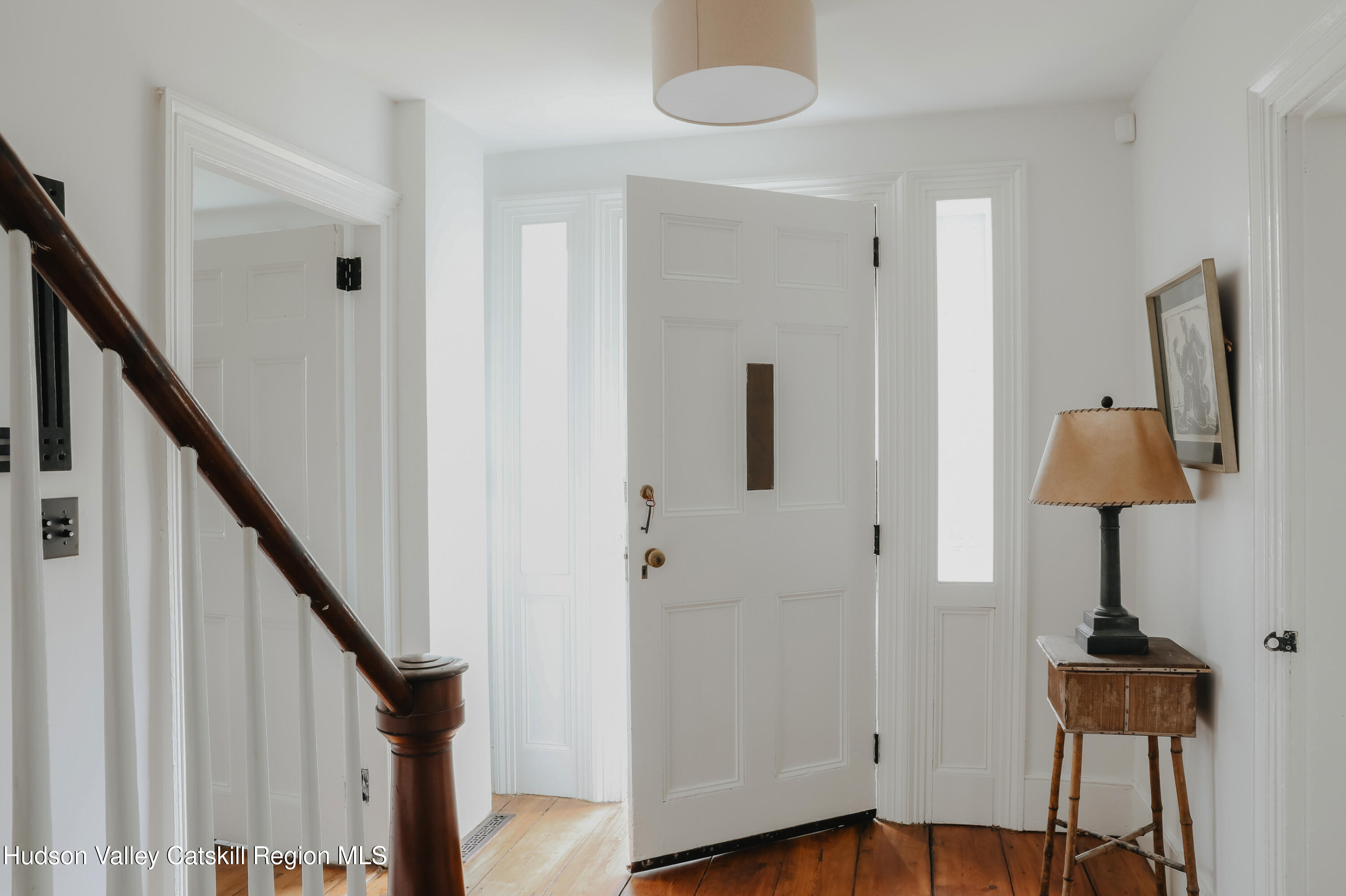 433 Rapp Road Valatie, NY 12184 - Photo 4 of 61 a view of a hallway with wooden floor and staircase
