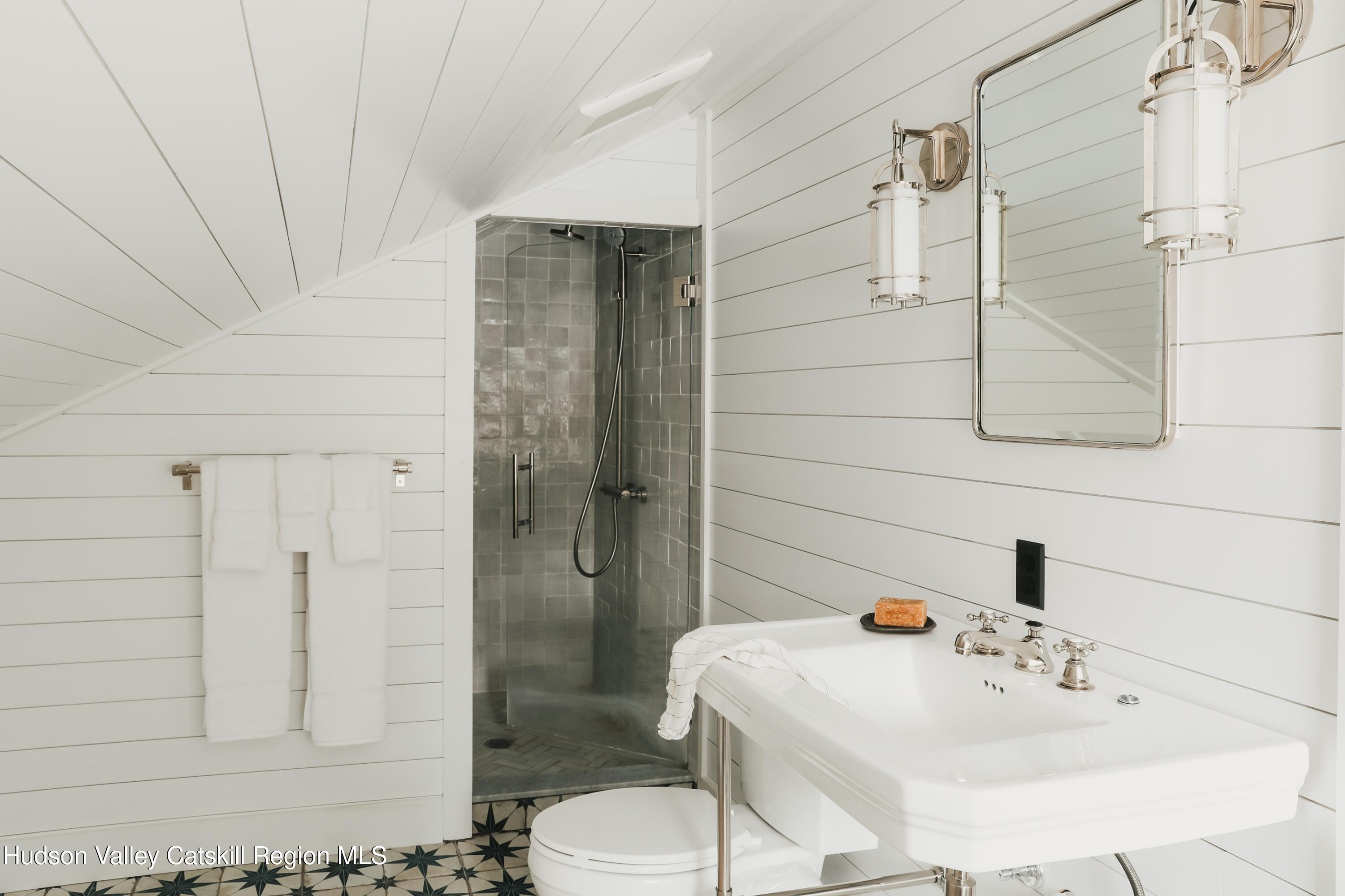 433 Rapp Road Valatie, NY 12184 - Photo 44 of 61 a bathroom with a sink a toilet and shower