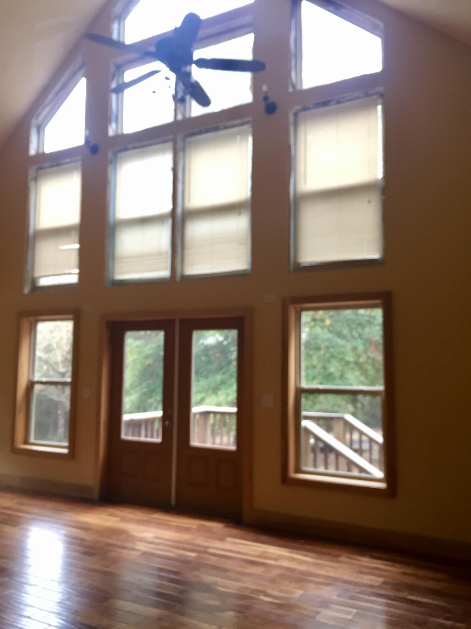 5960 Old Hickory Road Crestview, FL 32539 - Photo 2 of 43 a view of an empty room with wooden floor and a window