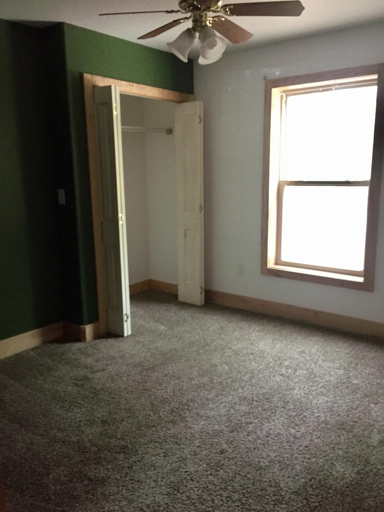 5960 Old Hickory Road Crestview, FL 32539 - Photo 17 of 43 an empty room with a window and a fan