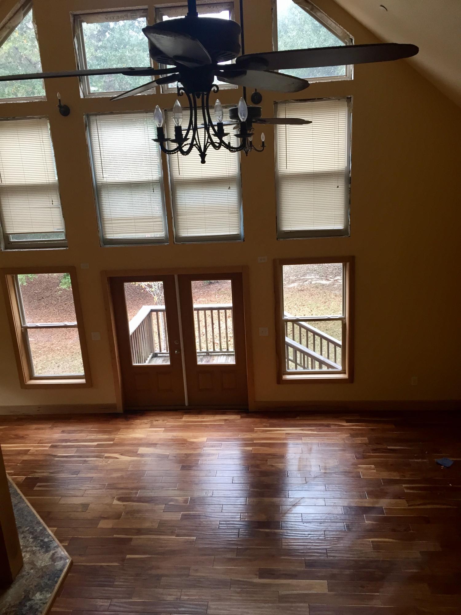5960 Old Hickory Road Crestview, FL 32539 - Photo 21 of 43 a view of an empty room with wooden floor and a window