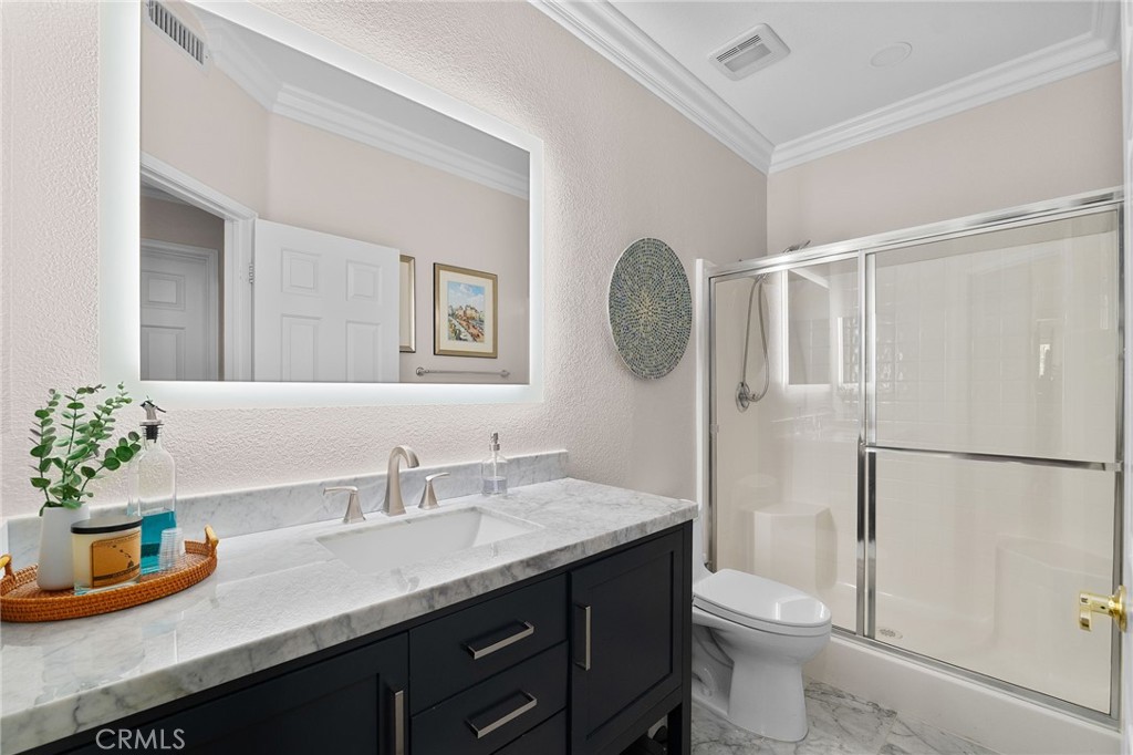 12759 East Rancho Estates Place Rancho Cucamonga, CA 91739 - Photo 31 of 69 a bathroom with a granite countertop sink toilet and shower