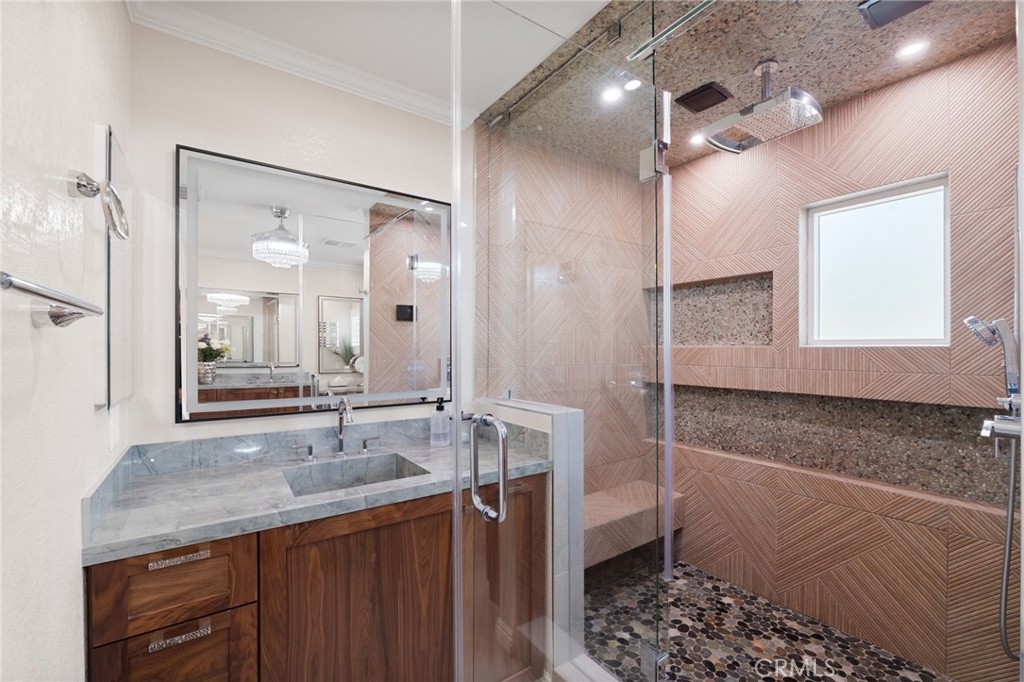 12759 East Rancho Estates Place Rancho Cucamonga, CA 91739 - Photo 36 of 69 a bathroom with a granite countertop sink a mirror and a shower