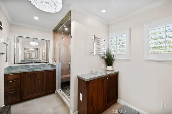a view of a patio with a table and chairs under an umbrella