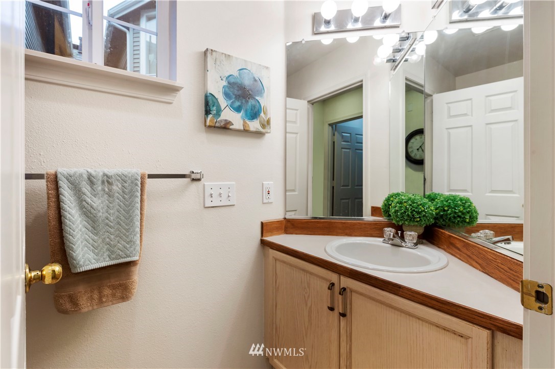 22611 4th Avenue West, Unit 104 Bothell, WA 98021 - Photo 14 of 24 a bathroom with a sink and a mirror