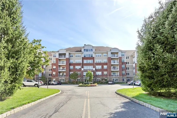 a large building with a yard in front of it