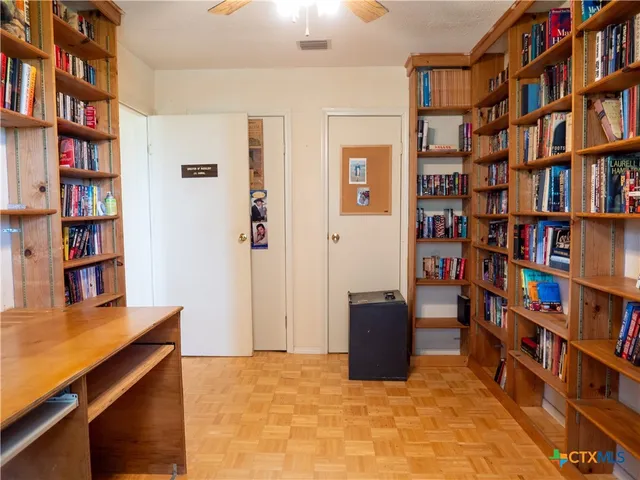 a view of room with furniture and book shelf