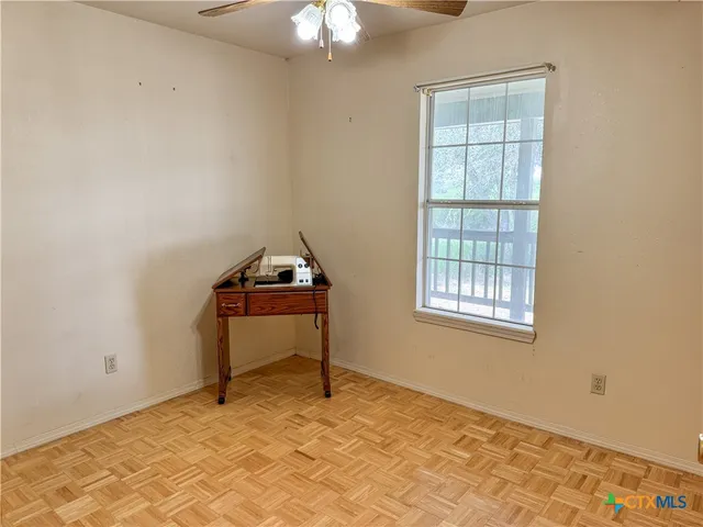 a view of balcony with wooden floor
