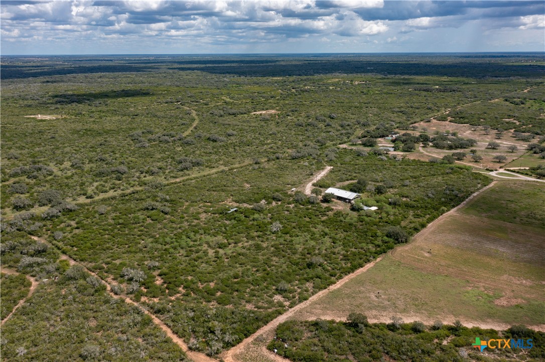 6611 Tigre Road Beeville, TX 78102 - Photo 25 of 31 a view of a lake from a yard