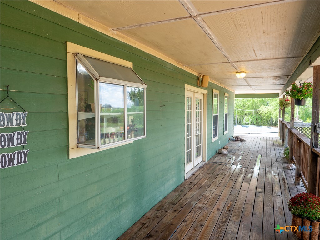 6611 Tigre Road Beeville, TX 78102 - Photo 6 of 31 a view of a house with a porch