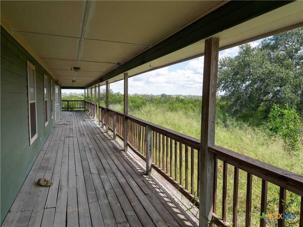 6611 Tigre Road Beeville, TX 78102 - Photo 7 of 31 a view of balcony with wooden floor