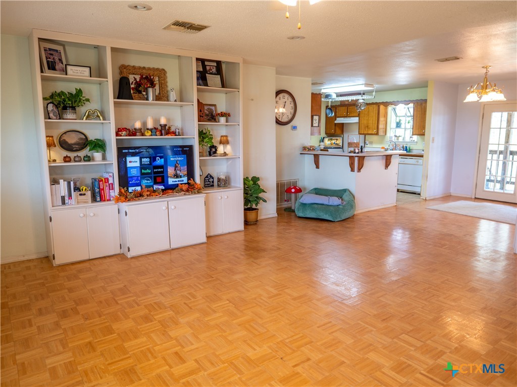 6611 Tigre Road Beeville, TX 78102 - Photo 9 of 31 a living room with furniture and a flat screen tv