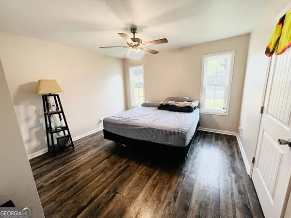 a bedroom with a bed and a table