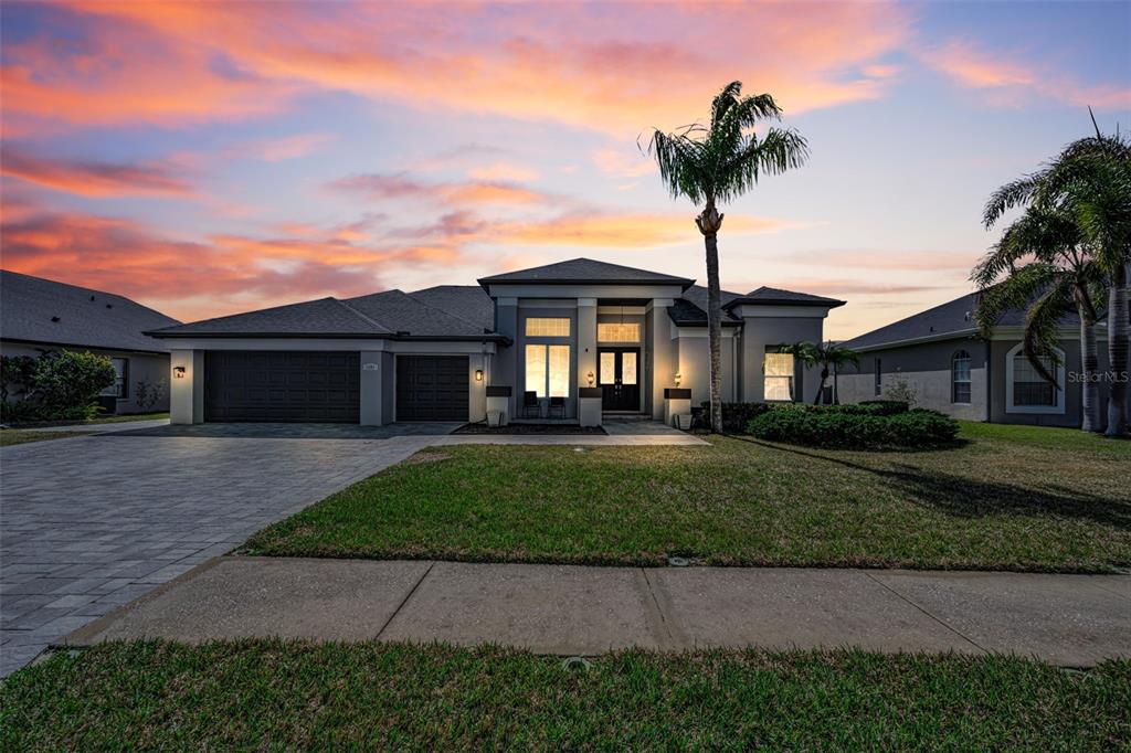 1151 Arlinbrook Drive Trinity, FL 34655 - Photo 1 of 69 a front view of a house with yard and garage