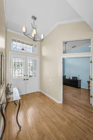 a dining room with furniture and wooden floor