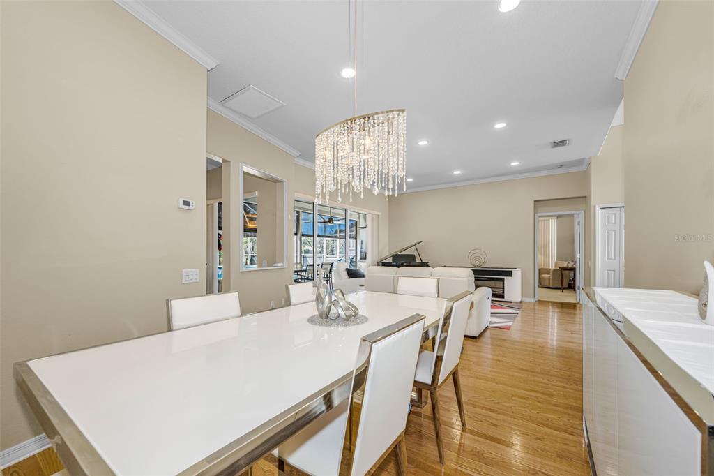 1151 Arlinbrook Drive Trinity, FL 34655 - Photo 27 of 69 a large kitchen with a table and chairs
