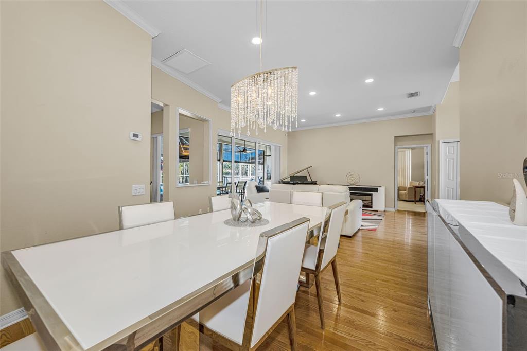 1151 Arlinbrook Drive Trinity, FL 34655 - Photo 28 of 69 a large kitchen with a table and chairs