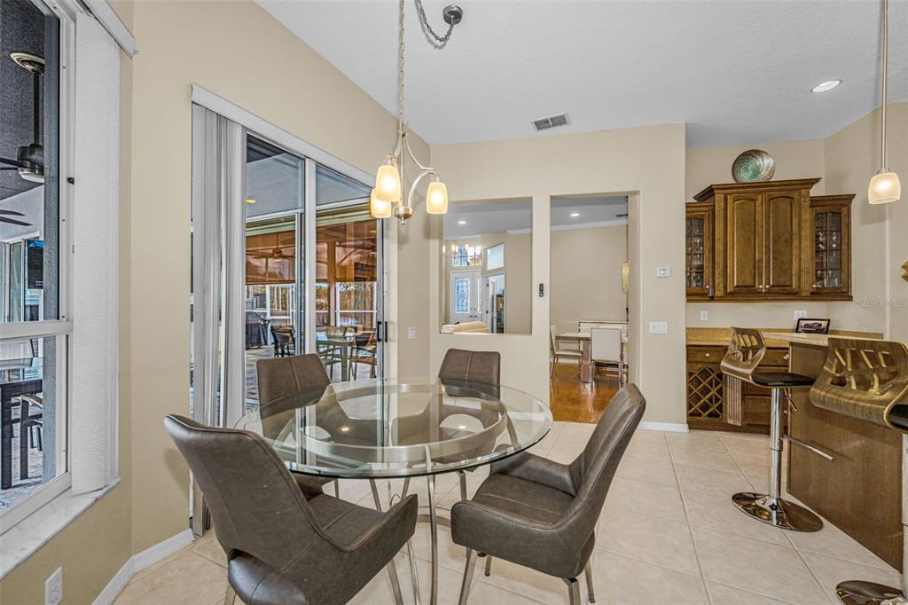 1151 Arlinbrook Drive Trinity, FL 34655 - Photo 37 of 69 a dining room with furniture and wooden floor