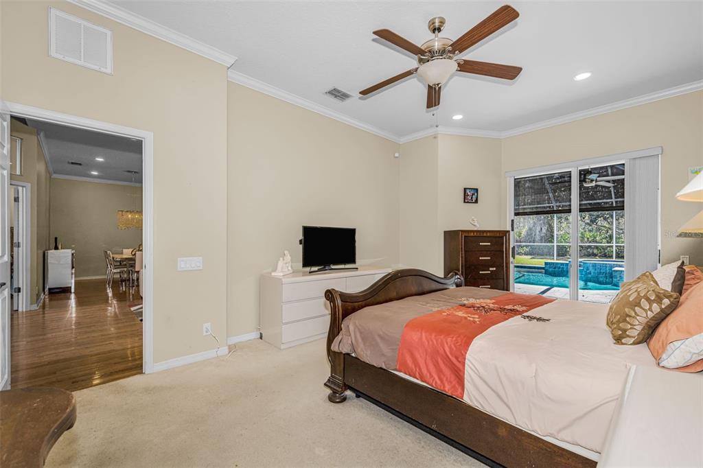 1151 Arlinbrook Drive Trinity, FL 34655 - Photo 44 of 69 a bedroom with a bed and a large window