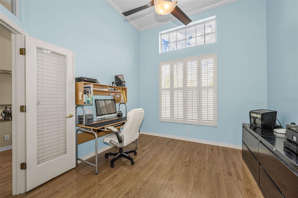 1151 Arlinbrook Drive Trinity, FL 34655 - Photo 49 of 69 a view of a workspace with furniture and a window