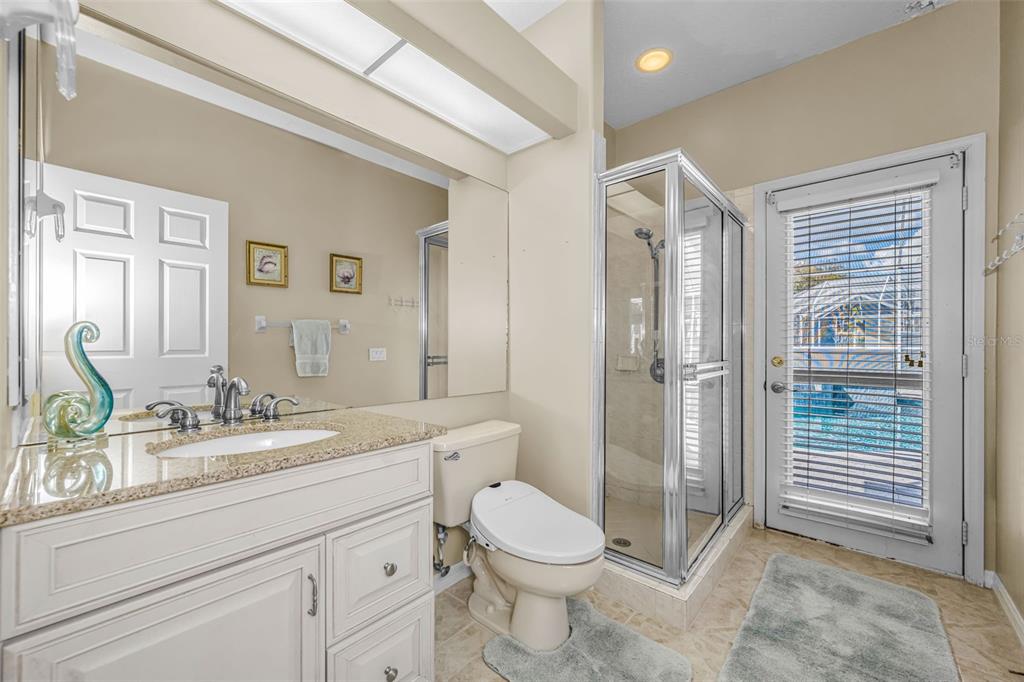 1151 Arlinbrook Drive Trinity, FL 34655 - Photo 52 of 69 a spacious bathroom with a granite countertop sink toilet a mirror and a shower