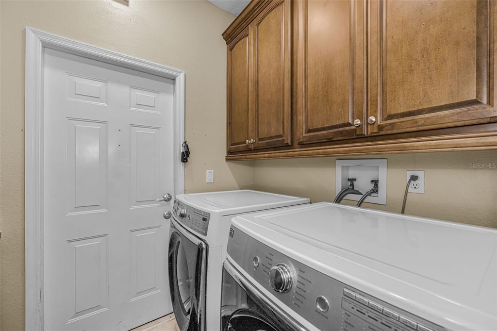 1151 Arlinbrook Drive Trinity, FL 34655 - Photo 56 of 69 a utility room with dryer and washer