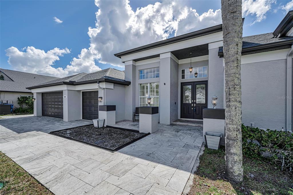 1151 Arlinbrook Drive Trinity, FL 34655 - Photo 6 of 69 a front view of a house with a yard