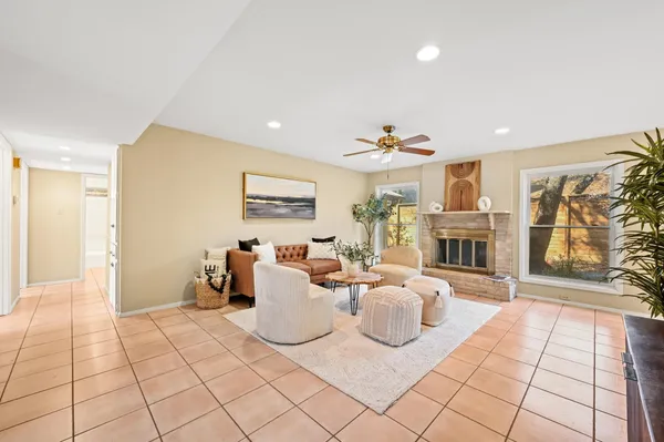 a living room with furniture and a fireplace