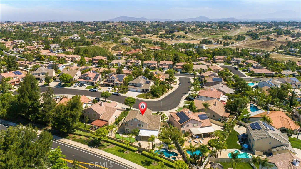 33351 Nicholas Common Temecula, CA 92592 - Photo 39 of 42 an aerial view of residential houses with outdoor space and trees