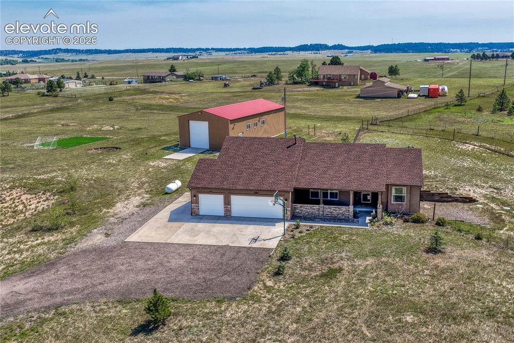 13695 Woodlake Road Elbert, CO 80106 - Photo 1 of 39 Perfectly situated 3,285 sq ft stucco/stone ranch home on 5 acres.
