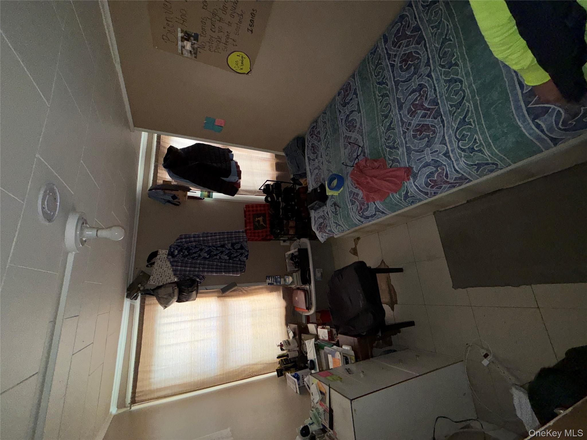 101 North Clinton Street Poughkeepsie, NY 12601 - Photo 6 of 11 Bedroom featuring light tile patterned floors and ornamental molding