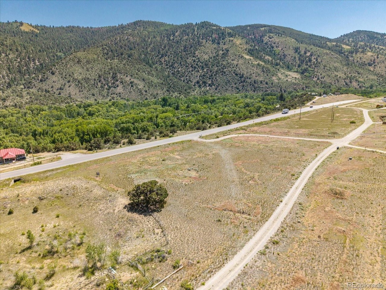 4 Rocky Mountain Road Salida, CO 81201 - Photo 9 of 27 a view of a dry yard with mountain